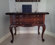 Vintage-style mahogany table with ball and claw legs and eight upholstered chairs. With French High-leg XV Antique sideboard and Chest of drawers