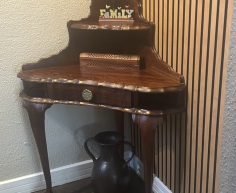 Queen Anne style corner table with ball and claw feet. 